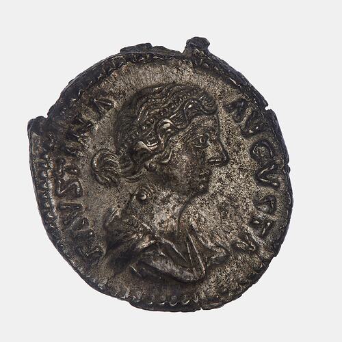 Roughly round coin. Draped bust of female facing right. Text around.