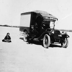 Digital Photograph - Holden Brothers Circus, Man Sitting in Shade & Girl Sitting in Sun by Circus Truck, Coorong, early 1930s