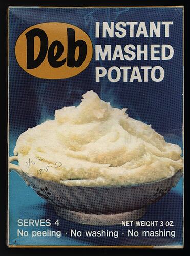 Smooth mashed potato in a white ceramic bowl. Blue background, printed text above and below.