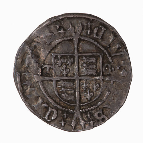 Coin, round, The reverse has a shield quartered with the arms of England and France, dividing the letters TC.