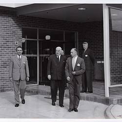 Photograph - Kodak Australasia Pty Ltd, Prime Minister Robert Menzies & Kodak Executives Exiting a Building at the Official Opening of the Kodak Factory, Coburg, 1961