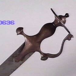 Long blade, Dark, curved ornate handle