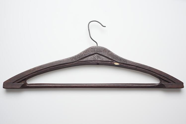 Wooden coat hanger with a metal handle