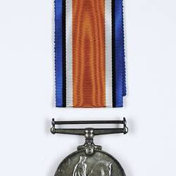 Round silver medal with blue, black, white and orange ribbon.