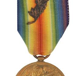 Round medal with winged female holding palm. Suspended from multi-coloured ribbon with metal oak leaf.