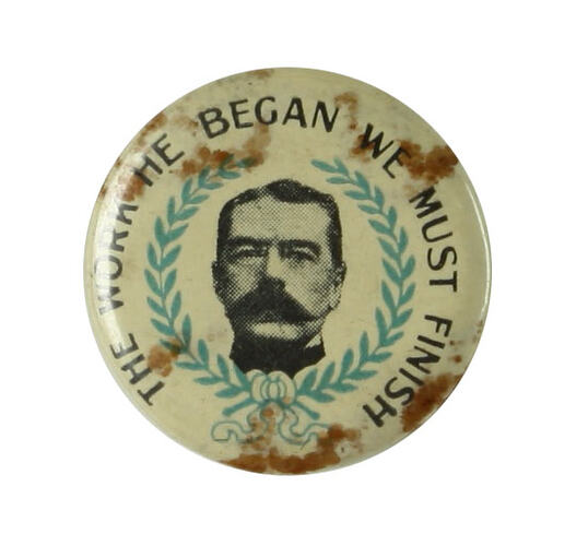 Front of badge showing Kitchener's portrait, rusted.