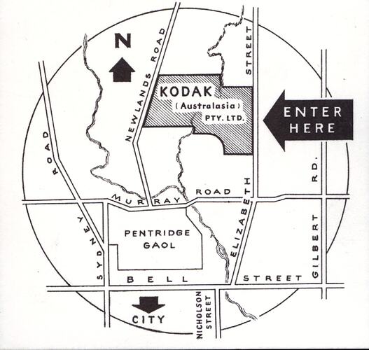 Circular, monochrome street map highlighting Kodak grounds.