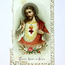 Front of card with depiction of Jesis and writing.