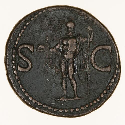 Round coin, aged, figure facing left, right hand holding out a small dolphin, left hand holding a trident.