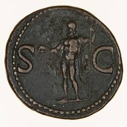 Round coin, aged, figure facing left, right hand holding out a small dolphin, left hand holding a trident.