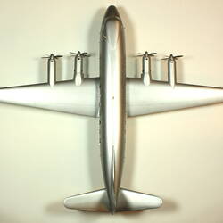 Silver model aeroplane with two propellers on each wing. Top view.