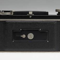 Back of metal and black plastic camera.