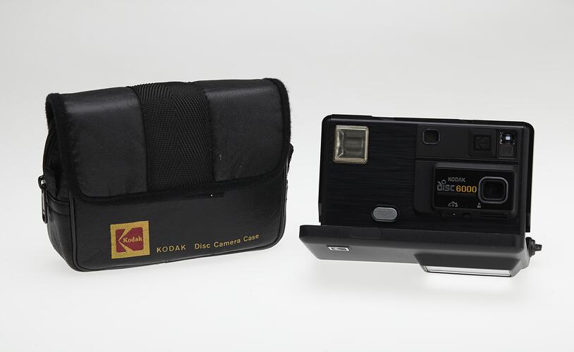 Black plastic camera with bag.