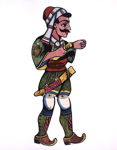 Two dimensional acrylic puppet of a man with a moustache wearing mostly green clothes and a gold scabbard.