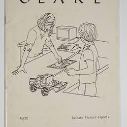 White front cover with black printed text and illustration of two children with a computer and truck.