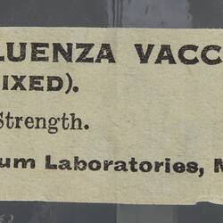 Thin paper label with printed text.