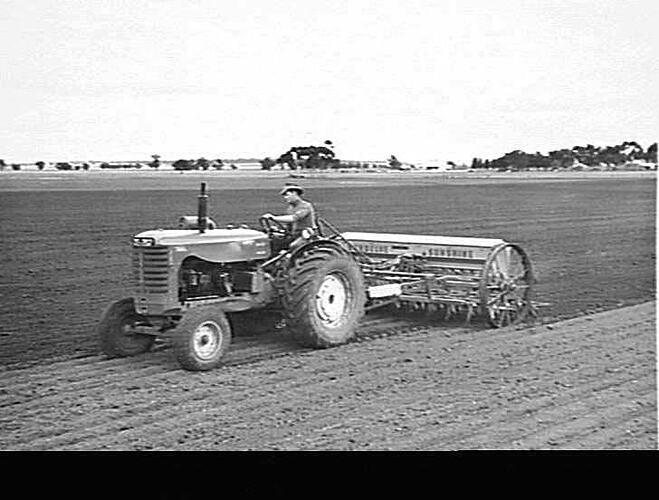 MR. F. W. MICHAEL, COPE COPE, VIC. WITH HIS NEW 16-TINE `SUNDELVE' RIGID TINE CULTIVATING DRILL AND 744 DIESEL TRACTOR, SOWING (350 ACRES) OATS: JUNE 1952