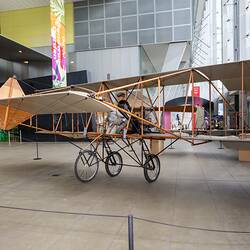 Replica aeroplane in museum foyer.