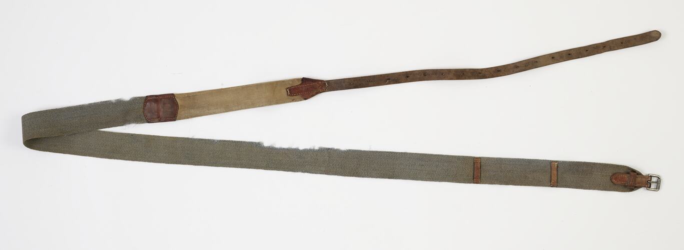 Surcingle is made from blue hessian webbing with four inches of elastic before the strap, with a long leather fastening strap.