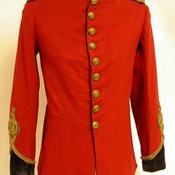 Red uniform jacket with gold trim and buttons and black cuffs.
