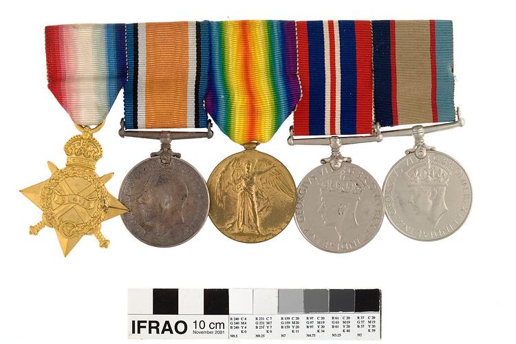 Five medals with multicoloured ribbons.