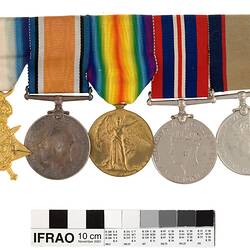 Five medals with multicoloured ribbons.