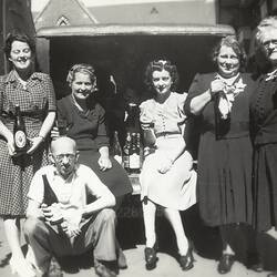 Four Women & One Man Sitting in Boot of Car Holding Beer Bottles, Family Christmas Party, South Yarra Primary School, 1945