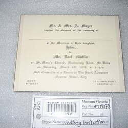 Printed wedding invitation on white card.