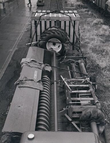 Header front and parts loaded onto a rail truck,