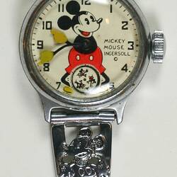 Watch, circular white dial, central Mickey, black numerals, three Mickey's minute disk at six, metal band.