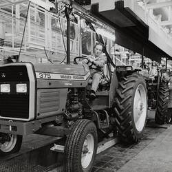 Photograph - Massey Ferguson, Worker Driving Tractor MF375 off Production Line, Banner Lane, Coventry, England, Nov 1986
