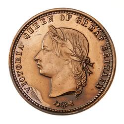 Round brown pattern token.
