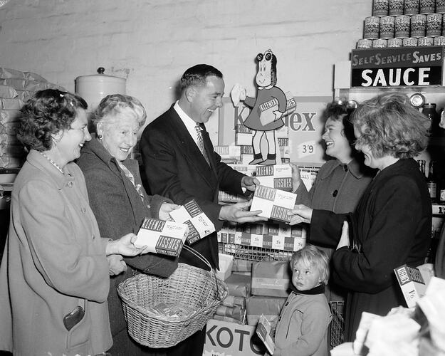 Group of People Next to a Klenex Tissue Display in a Shells Self Serve Store, Pacoe Vale, Victoria, Sep 1955