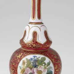 Ruby red and white blown glass vase with gilt arabesque style tendril design, and enamelled floral panels