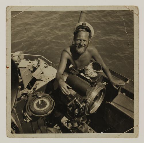 Seamen without shirt, on board ship.