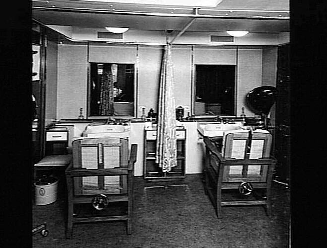 Ship interior. Hairdresser salon with two chairs and mirrors.