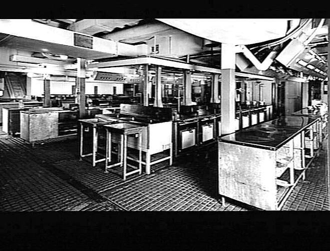 Ship interior. Main kitchen galley. Metal benchtops and ovens.
