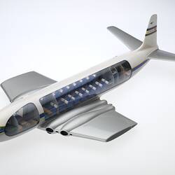 Model aeroplane with clear side panels showing internal cockpit and seating.