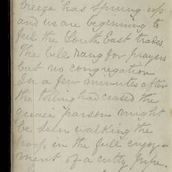 Open diary with handwritten text on discoloured worn page.