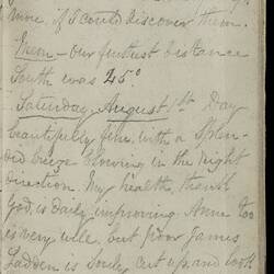 Open diary with handwritten text on discoloured worn page.