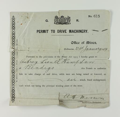 Square shaped paper with coat of arms in top-centre, written and printed text below.