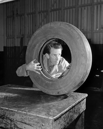 Beaurepaires, Workman Examining a Tyre, Flemington, Victoria, 04 Mar 1960