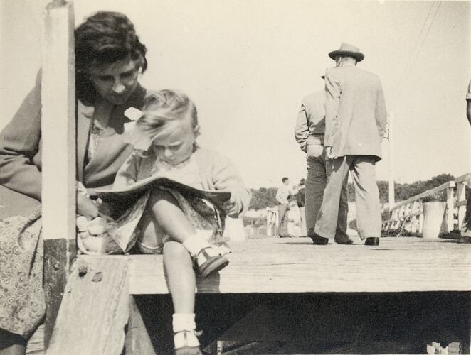 Eileen & Susan Leech Sitting Reading on Frankston Pier, Frankston, circa 1954