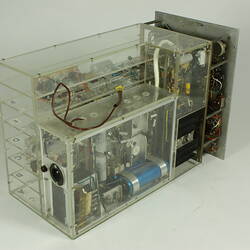 Control box, partially in clear box that shows internal wiring and components.