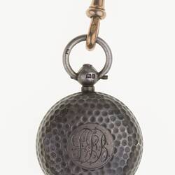 Detail of silver watch chain with silver sovereign case.