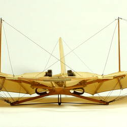 Model of off-white glider. Front view.