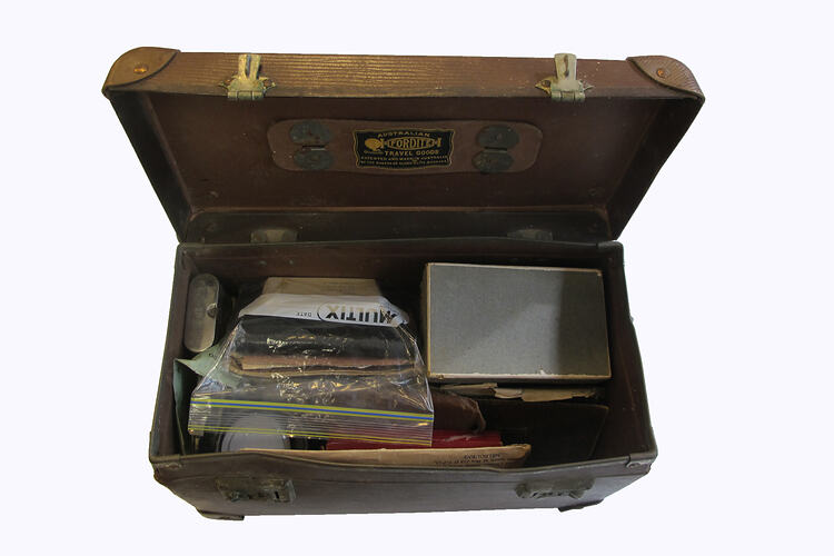 Open suitcase with documents inside.