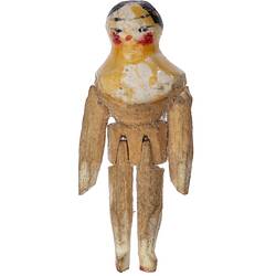 Wooden doll with painted head and shoulders.