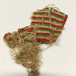 Worn and frayed green, red and white striped medal ribbon.