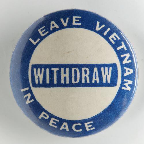 Round blue and white badge with white text.